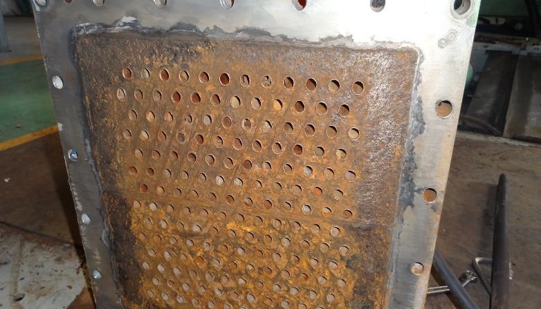 IHI TRE60 tube sheet after cleaning — all tube entrances open