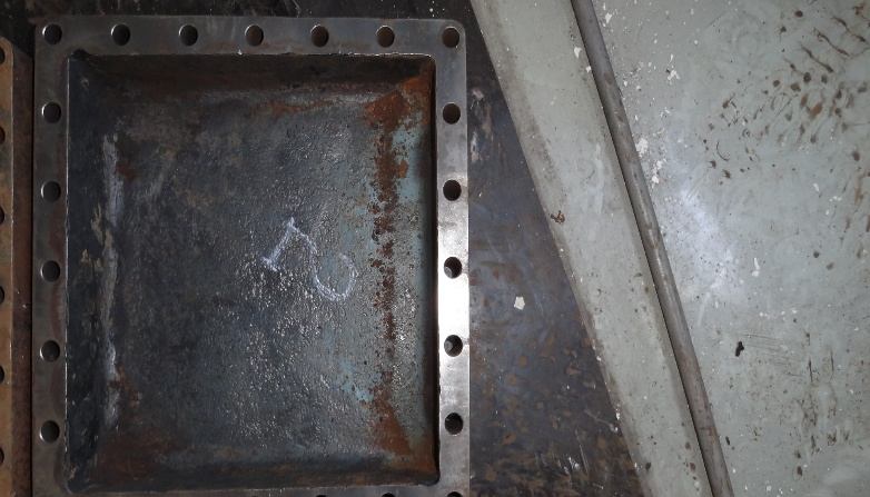 IHI TRE60 cooler end cover after grinding — rust removed