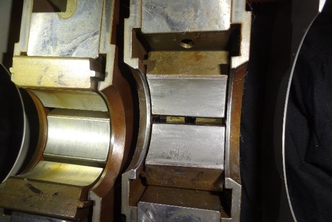 IHI TX-A 1st-stage bearing pad after carbon removal — pits remain