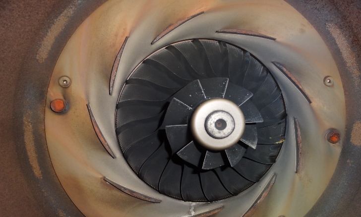 IHI TX-A 2nd-stage impeller before cleaning — trailing edge eroded by cavitation