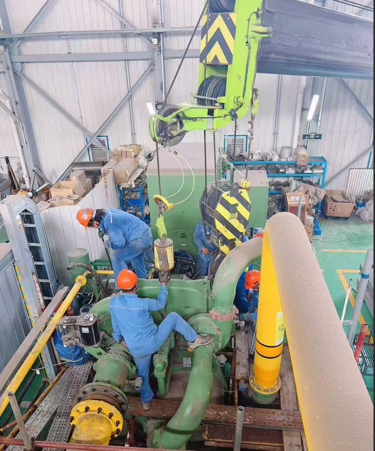 Cameron MSG overhaul — overhead crane lifting compressor section on site