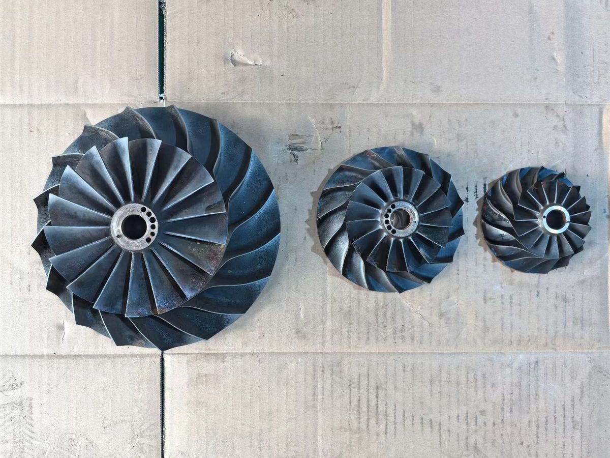 Cameron TA6000 overhaul — three impellers of decreasing diameter laid out for inspection