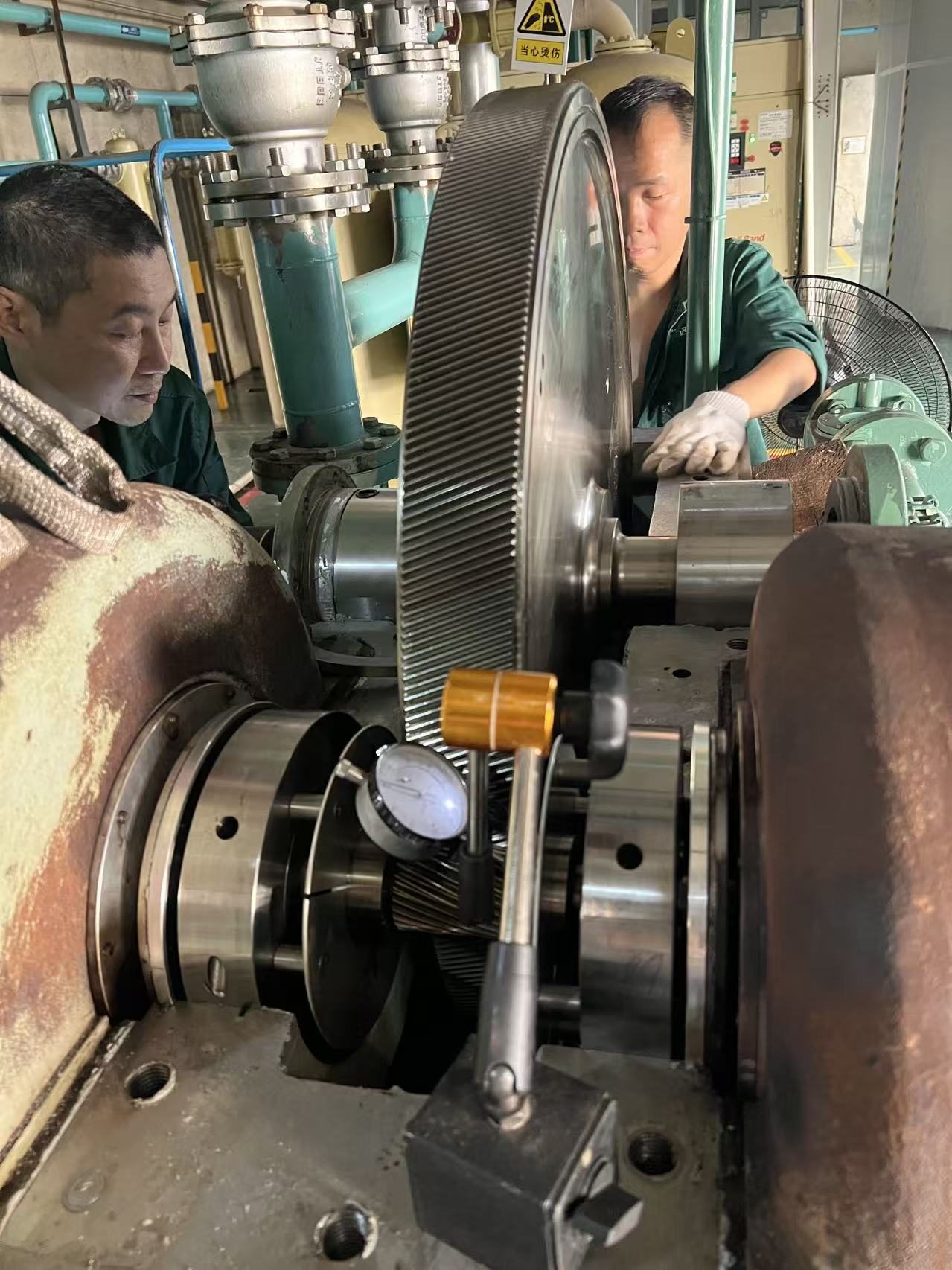 Turbomax service engineers measuring the bull gear on an IHI TX-A compressor during the surge diagnosis and repair job